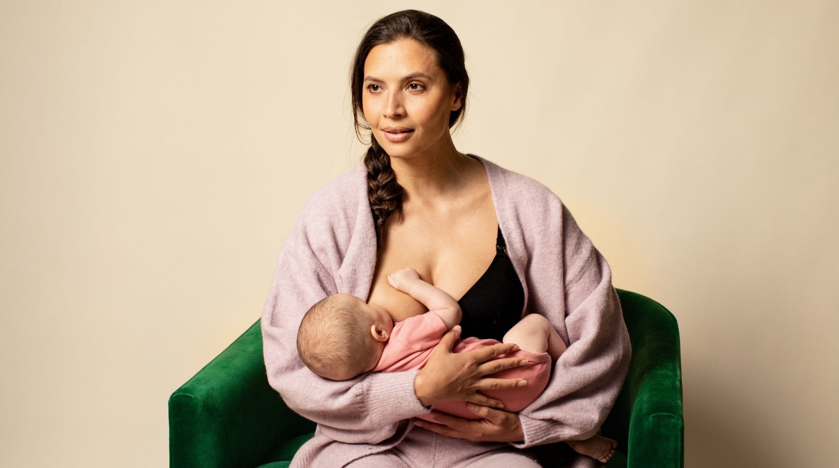Mother feeding baby breastmilk