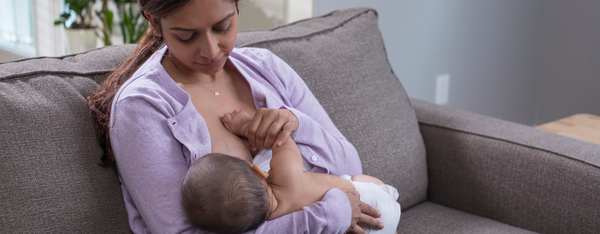 breastfeeding baby on the couch