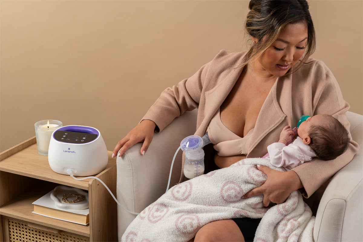 Image of a mom using a Lansinoh breast pump