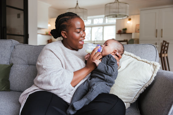 Mom Feeding Baby Lansinoh Bottle