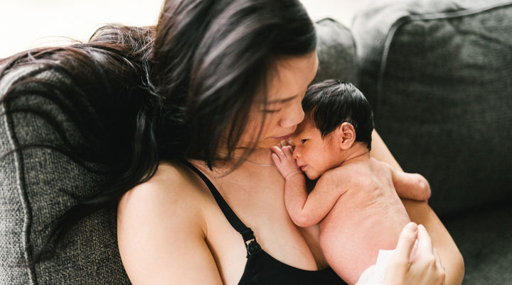 Image of postpartum mom with baby; Moms feel unprepared for and unsupported during postpartum